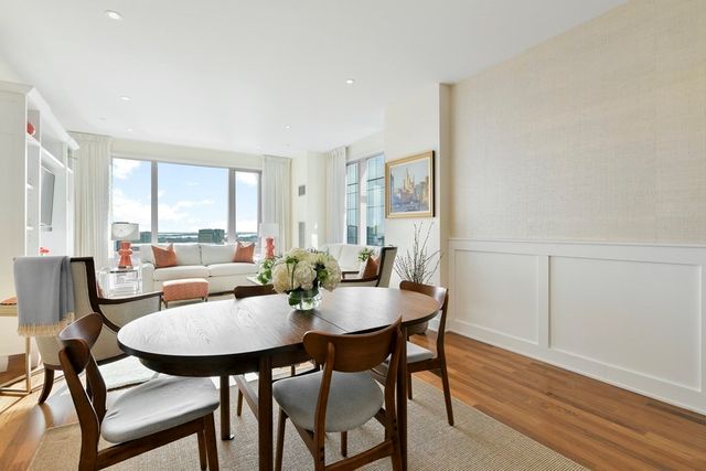 a view of a dining room with furniture and window