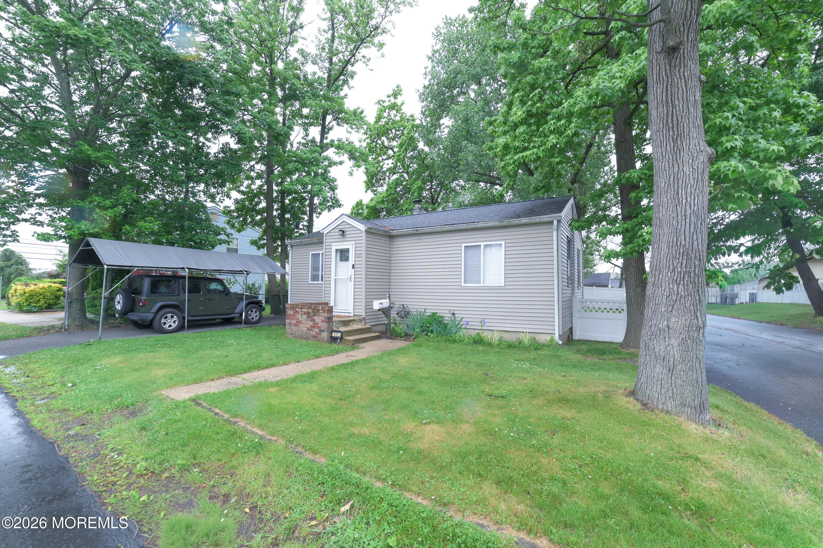 501 Gulden Street Keyport, NJ 07735 - Photo 1 of 14 a view of a house with a yard and large trees