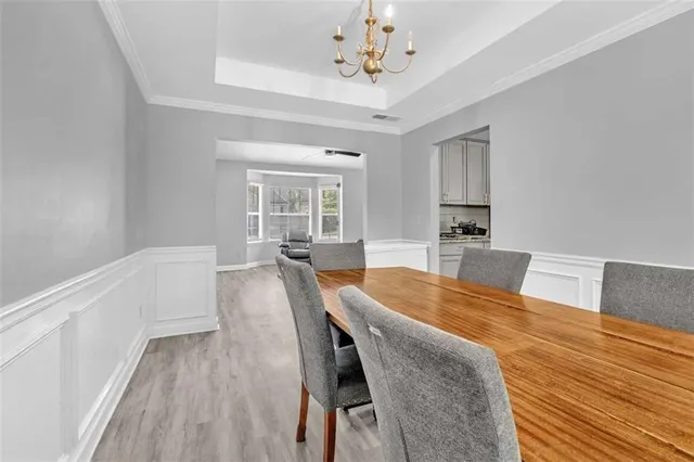 a view of a dining room with furniture and wooden floor