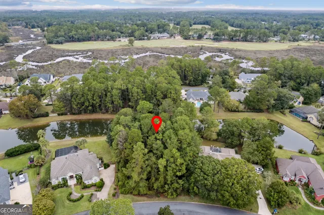 an aerial view of houses with yard
