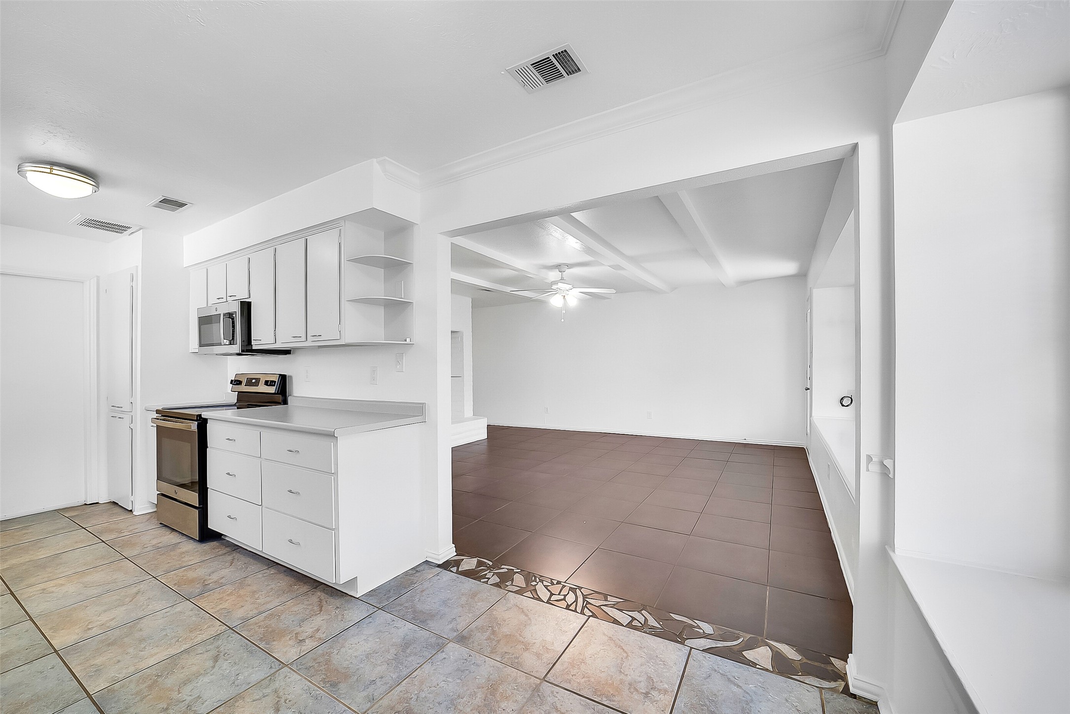 23123 Lestergate Drive Spring, TX 77373 - Photo 11 of 24 a kitchen with white cabinets and white appliances