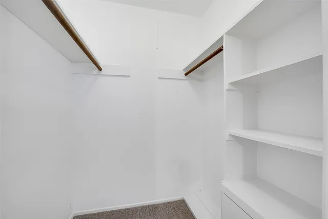 a view of staircase with white walls