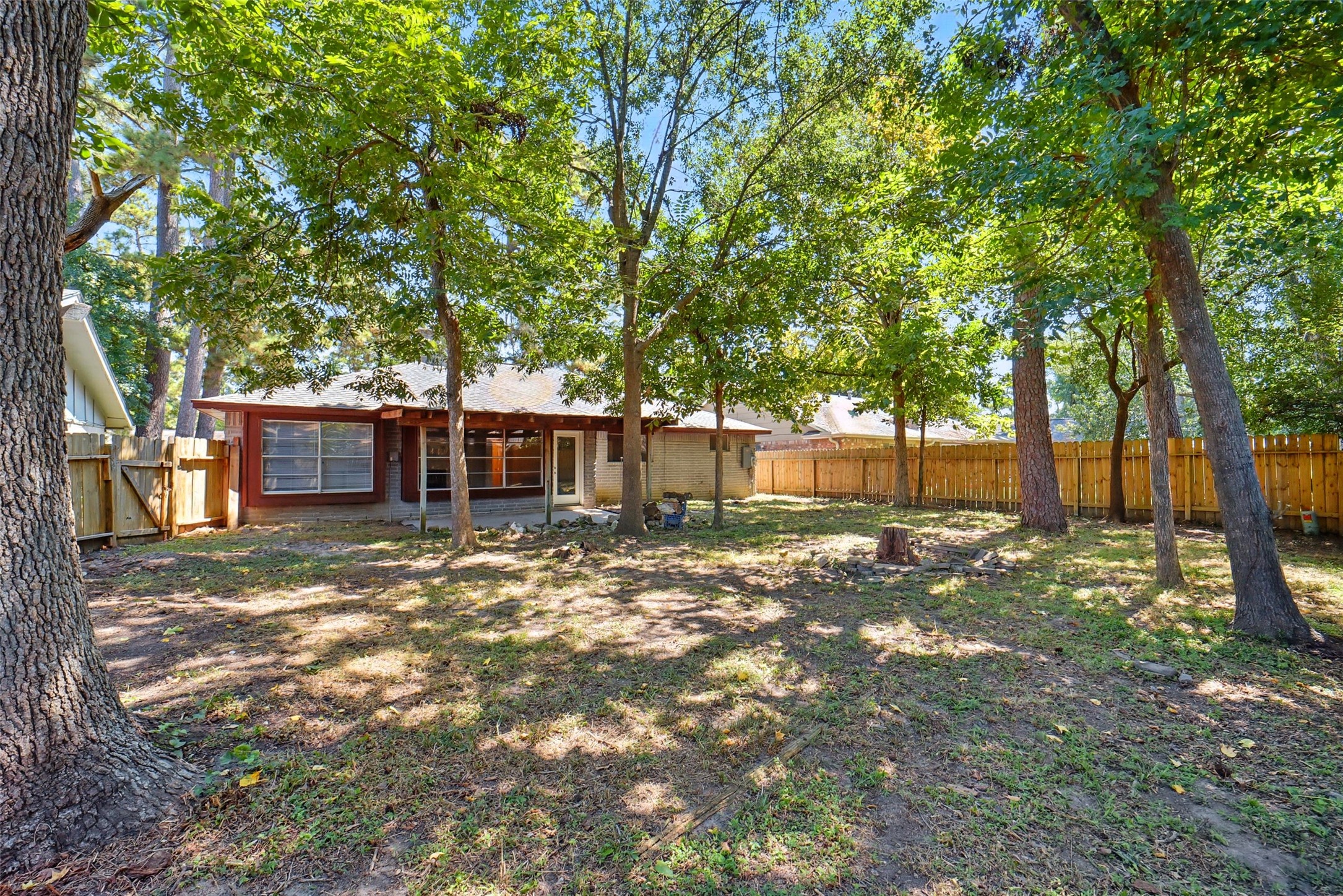 23123 Lestergate Drive Spring, TX 77373 - Photo 23 of 24 a view of a yard with a tree and a yard