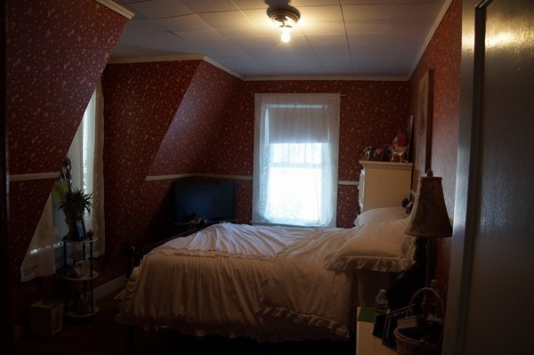 13 Marshbrook Road Billerica, MA 01821 - Photo 17 of 24 a bed sitting in a bedroom next to a window