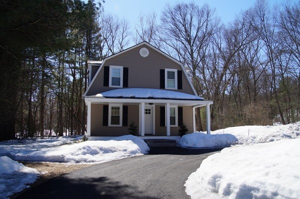 13 Marshbrook Road Billerica, MA 01821 - Photo 2 of 24 a view of a white house with large trees and floor to ceiling windows