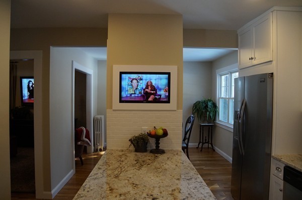 13 Marshbrook Road Billerica, MA 01821 - Photo 8 of 24 a living room with furniture a rug and a painting on the wall
