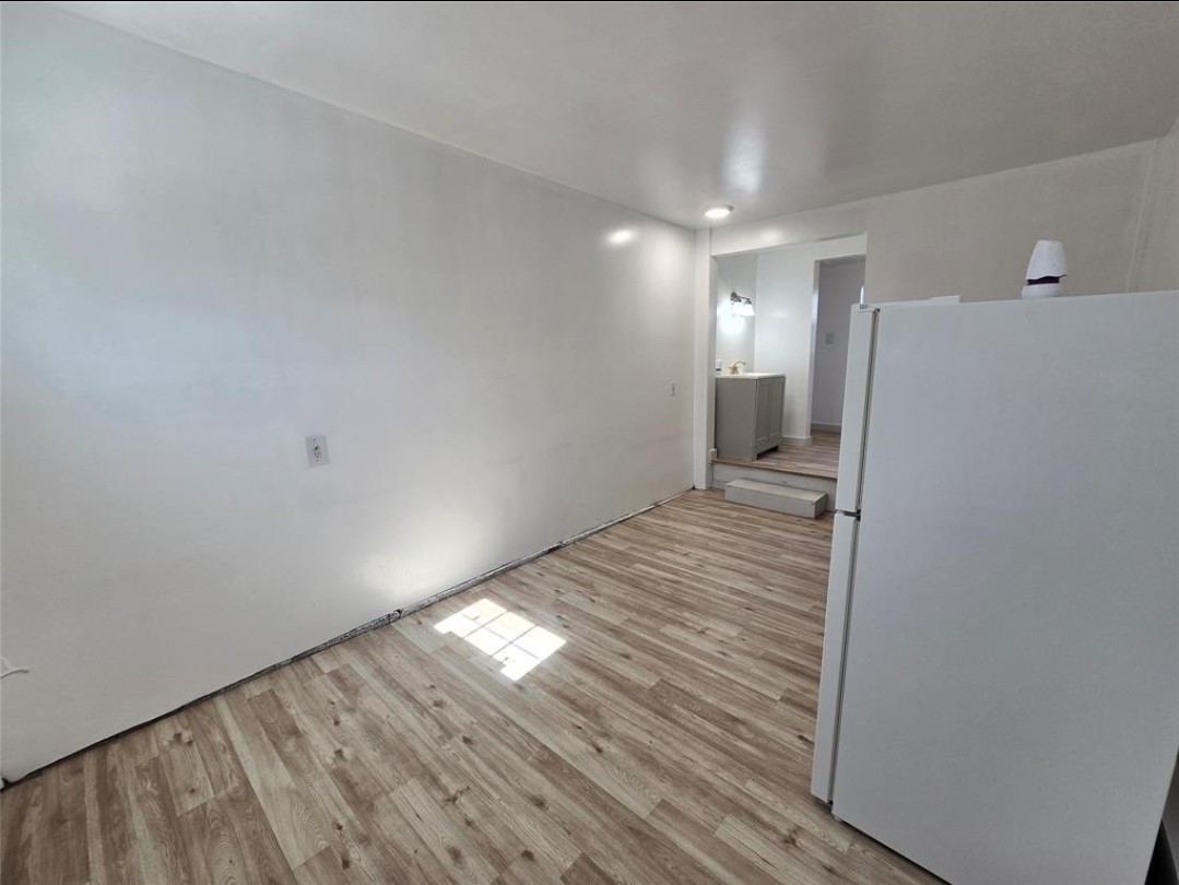 3125 Illinois Street, Unit C Baytown, TX 77520 - Photo 2 of 7 a view of a hallway with wooden floor