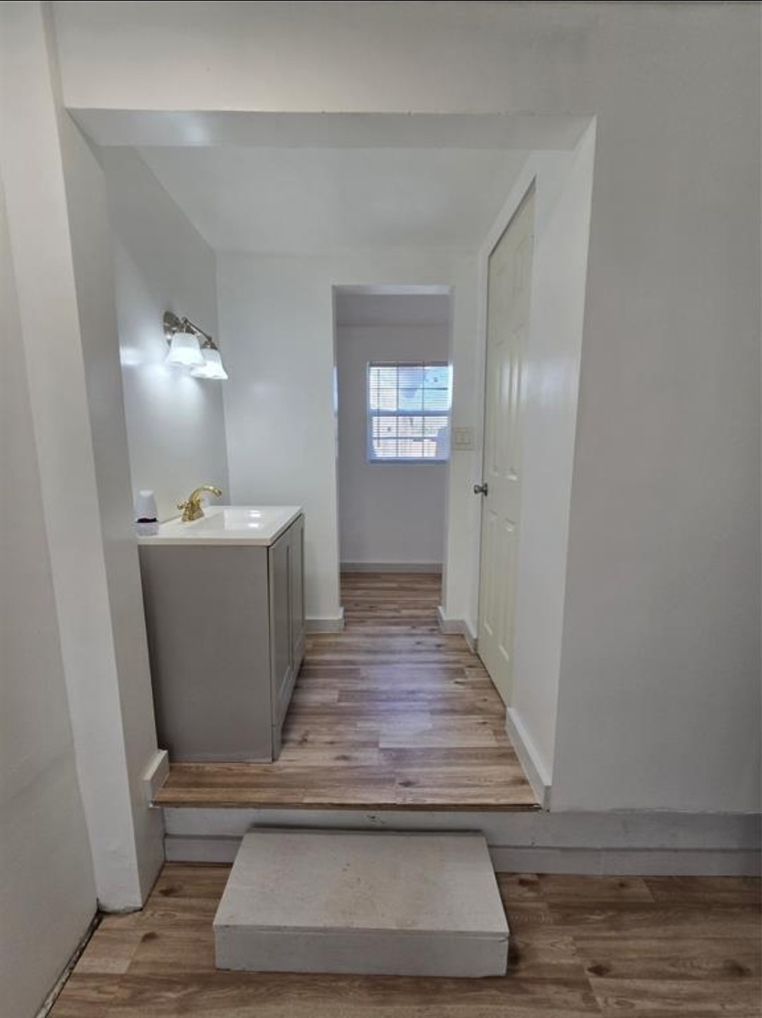 3125 Illinois Street, Unit C Baytown, TX 77520 - Photo 3 of 7 a view of a hallway with wooden floor and staircase