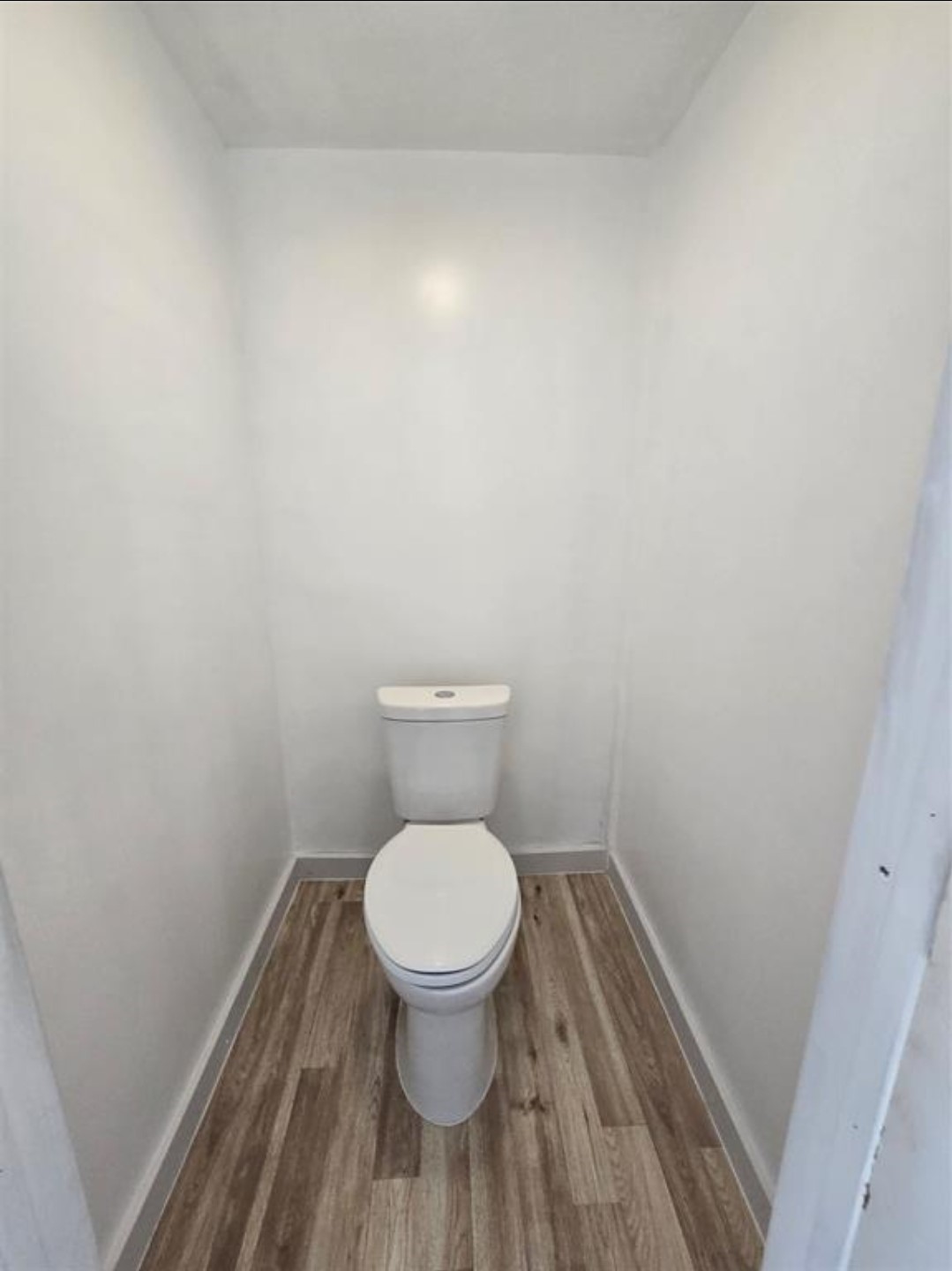 3125 Illinois Street, Unit C Baytown, TX 77520 - Photo 6 of 7 a bathroom with a toilet and a sink