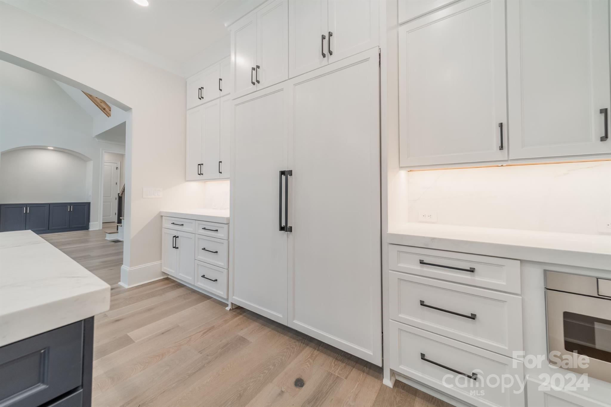 10829 Caroline Acres Road Fort Mill, SC 29707 - Photo 13 of 21 a kitchen with stainless steel appliances cabinets and wooden floor
