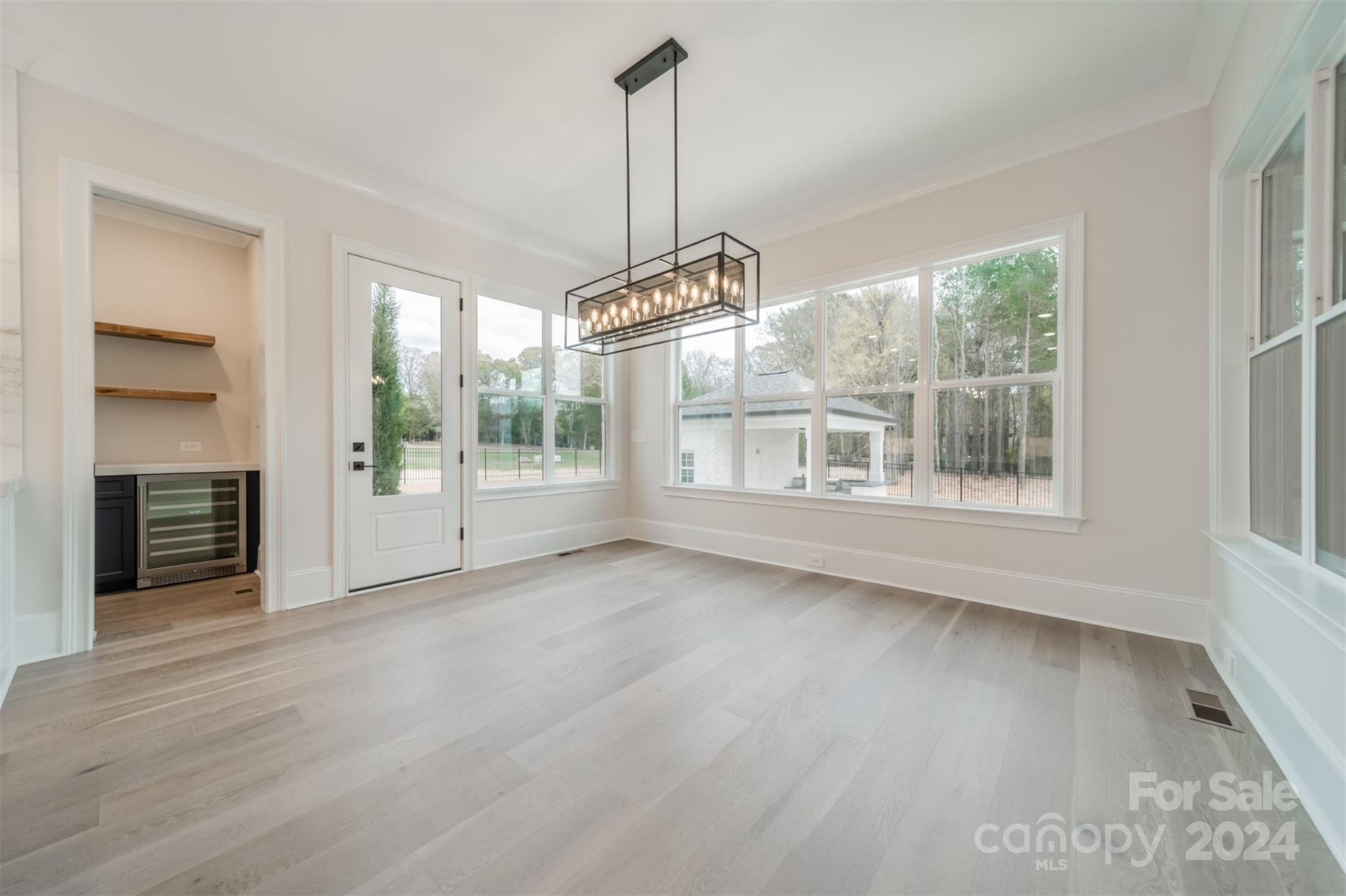 10829 Caroline Acres Road Fort Mill, SC 29707 - Photo 14 of 21 a view of a room with wooden floor fireplace and windows