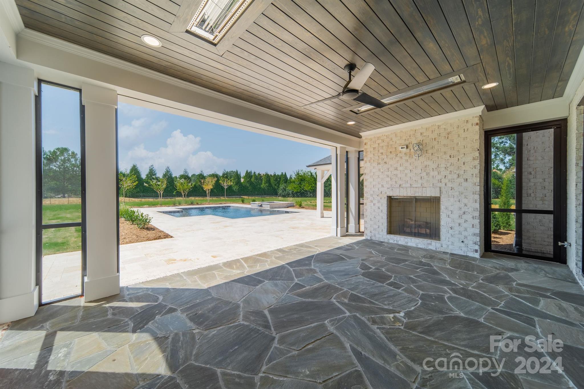 10829 Caroline Acres Road Fort Mill, SC 29707 - Photo 18 of 21 a view of an empty room with a fireplace and a window