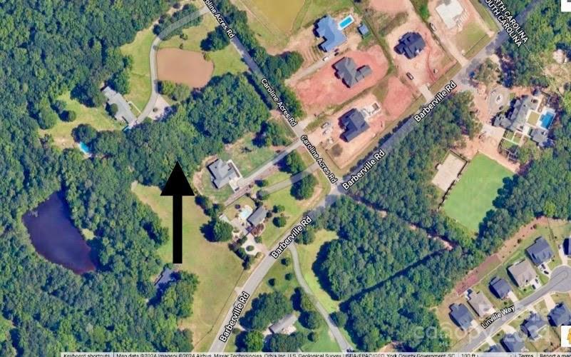 10829 Caroline Acres Road Fort Mill, SC 29707 - Photo 2 of 21 an aerial view of a house with a yard and garden