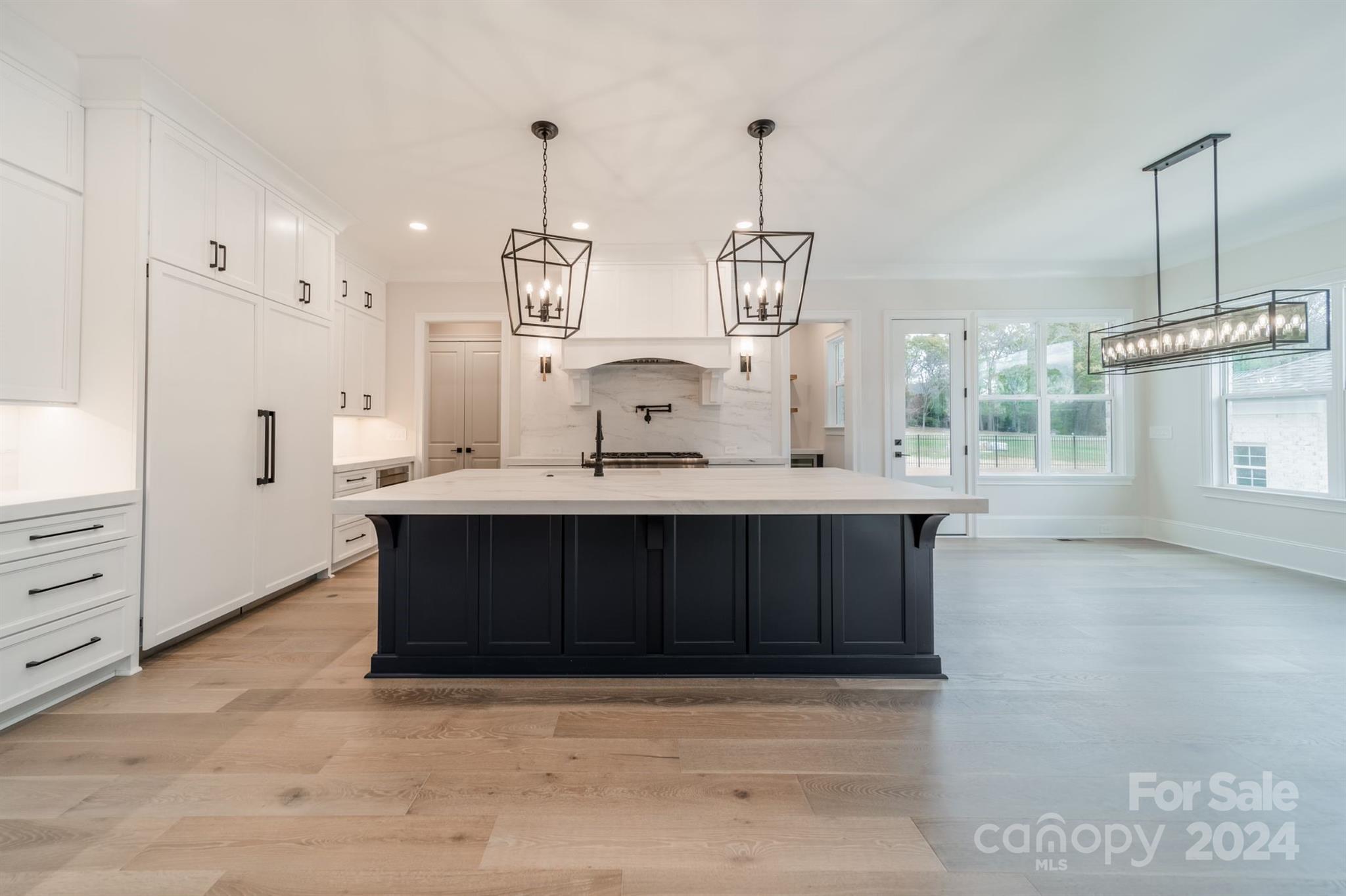 10829 Caroline Acres Road Fort Mill, SC 29707 - Photo 6 of 21 a kitchen with stainless steel appliances a sink stove and cabinets
