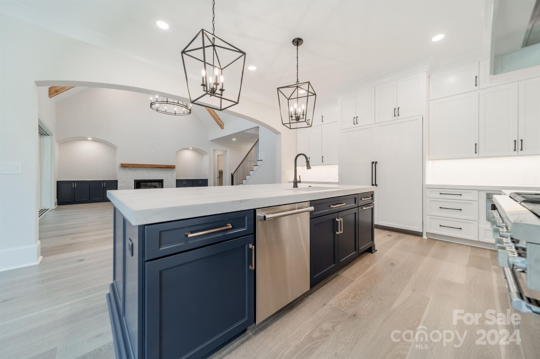 10829 Caroline Acres Road Fort Mill, SC 29707 - Photo 9 of 21 a kitchen with a sink a stove and a wooden floor