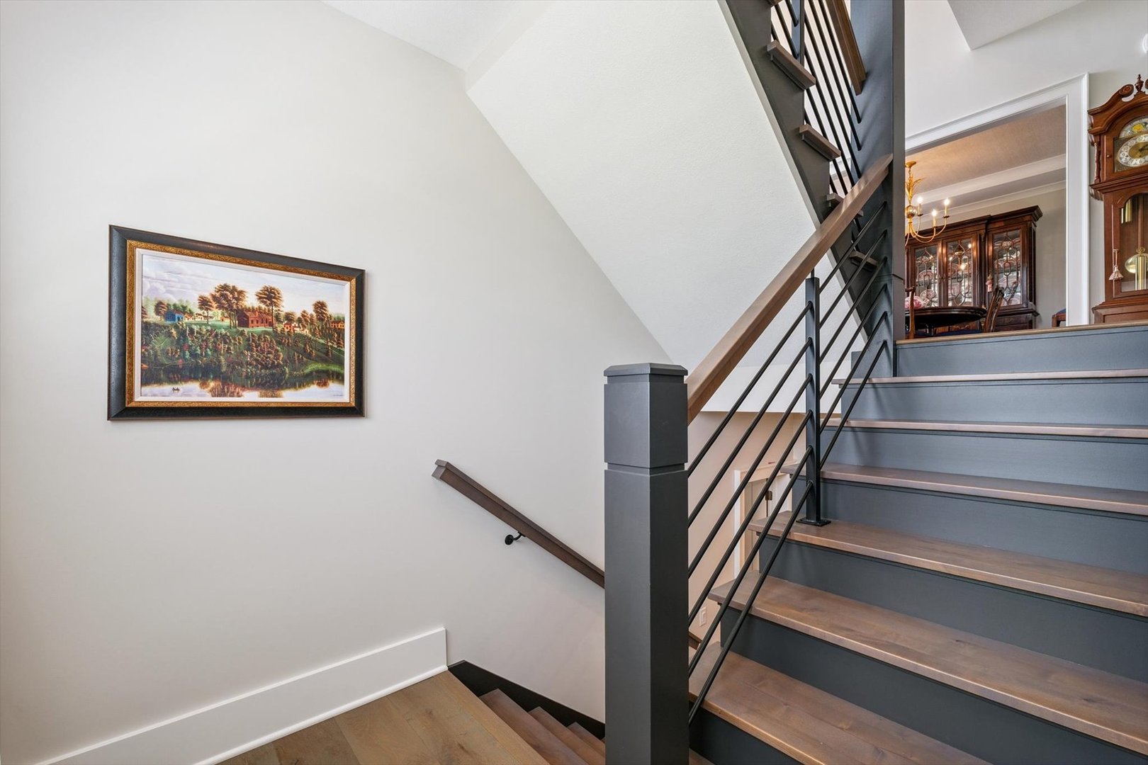 604 Cayman Way Savoy, IL 61874 - Photo 105 of 138 a view of staircase with wooden floor and a chandelier