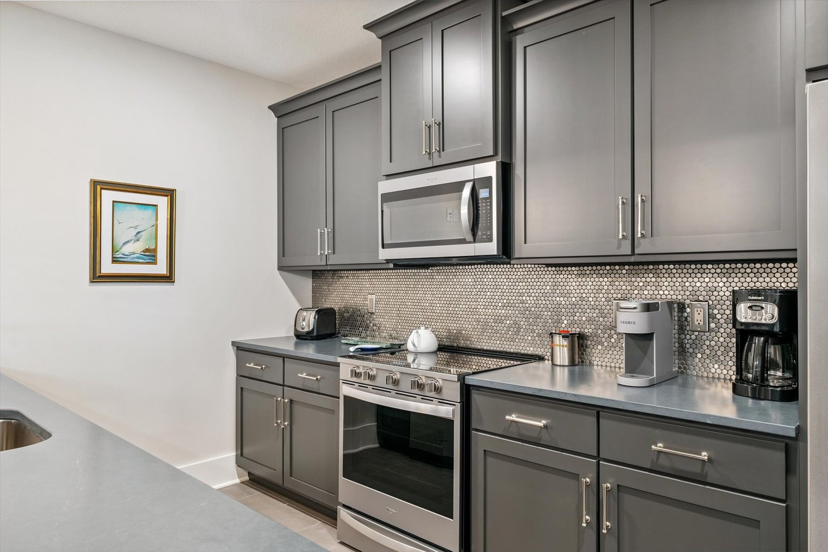604 Cayman Way Savoy, IL 61874 - Photo 112 of 138 a kitchen with stainless steel appliances granite countertop white cabinets stove and microwave