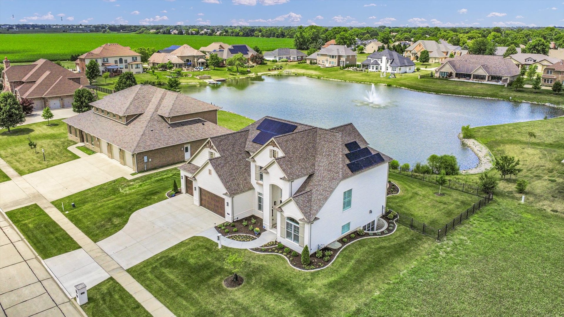 604 Cayman Way Savoy, IL 61874 - Photo 124 of 138 an aerial view of residential houses with outdoor space and lake view
