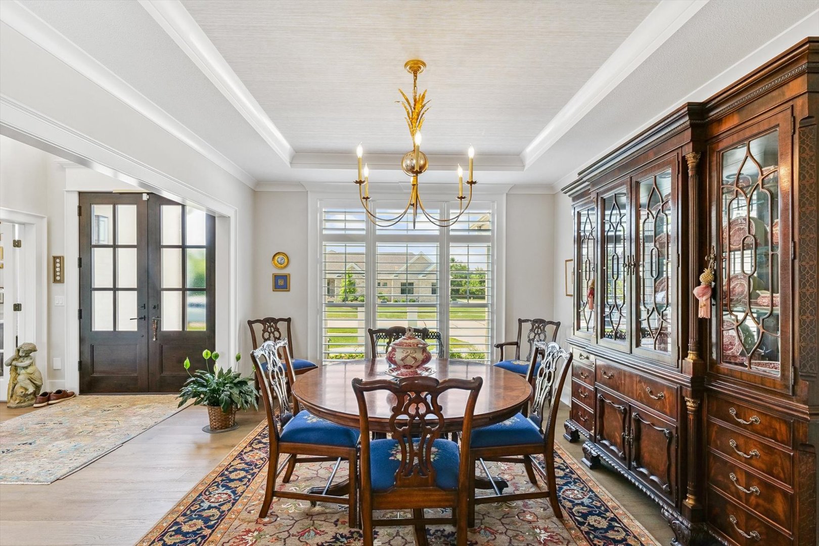 604 Cayman Way Savoy, IL 61874 - Photo 22 of 138 a dining room with furniture a chandelier and wooden floor