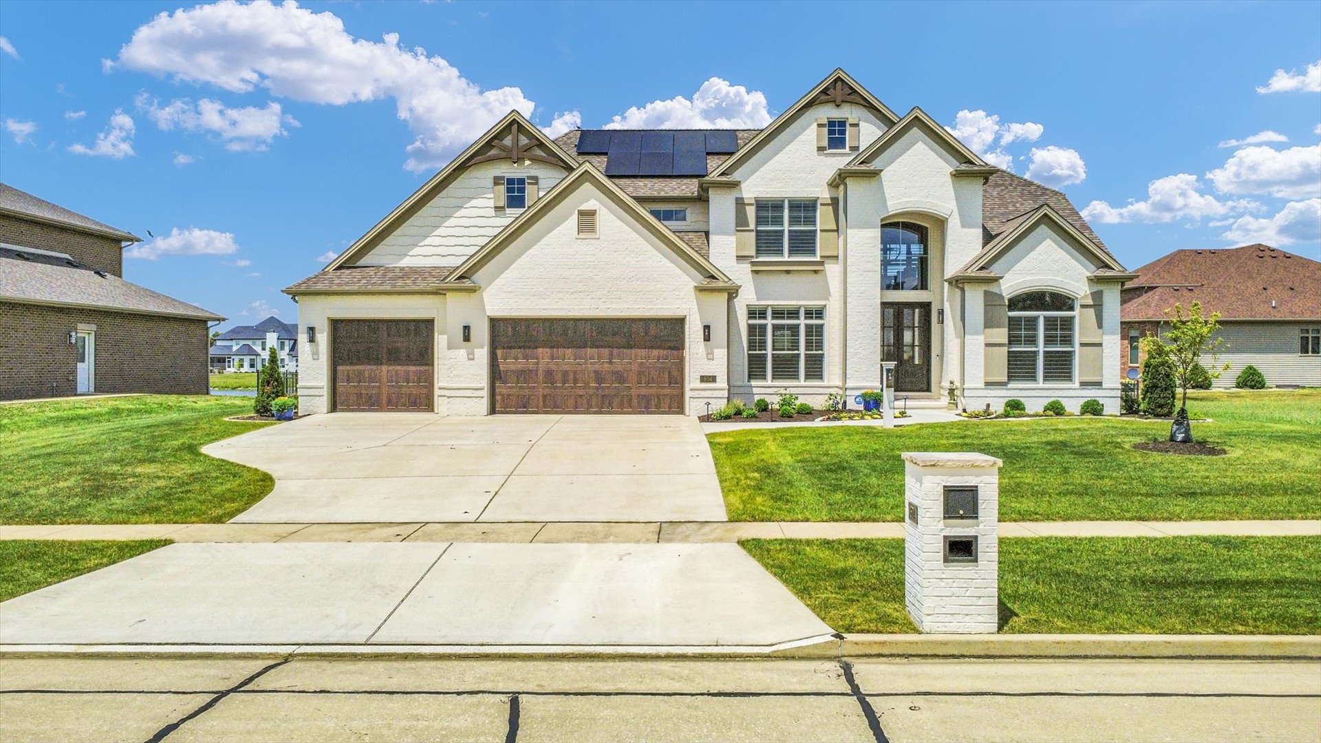 604 Cayman Way Savoy, IL 61874 - Photo 5 of 138 a front view of a house with a yard and garage