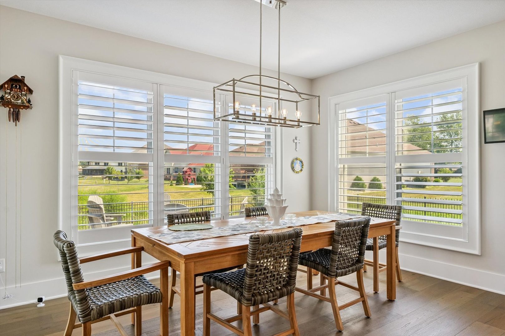 604 Cayman Way Savoy, IL 61874 - Photo 70 of 138 a view of a dining room with furniture large windows and wooden floor