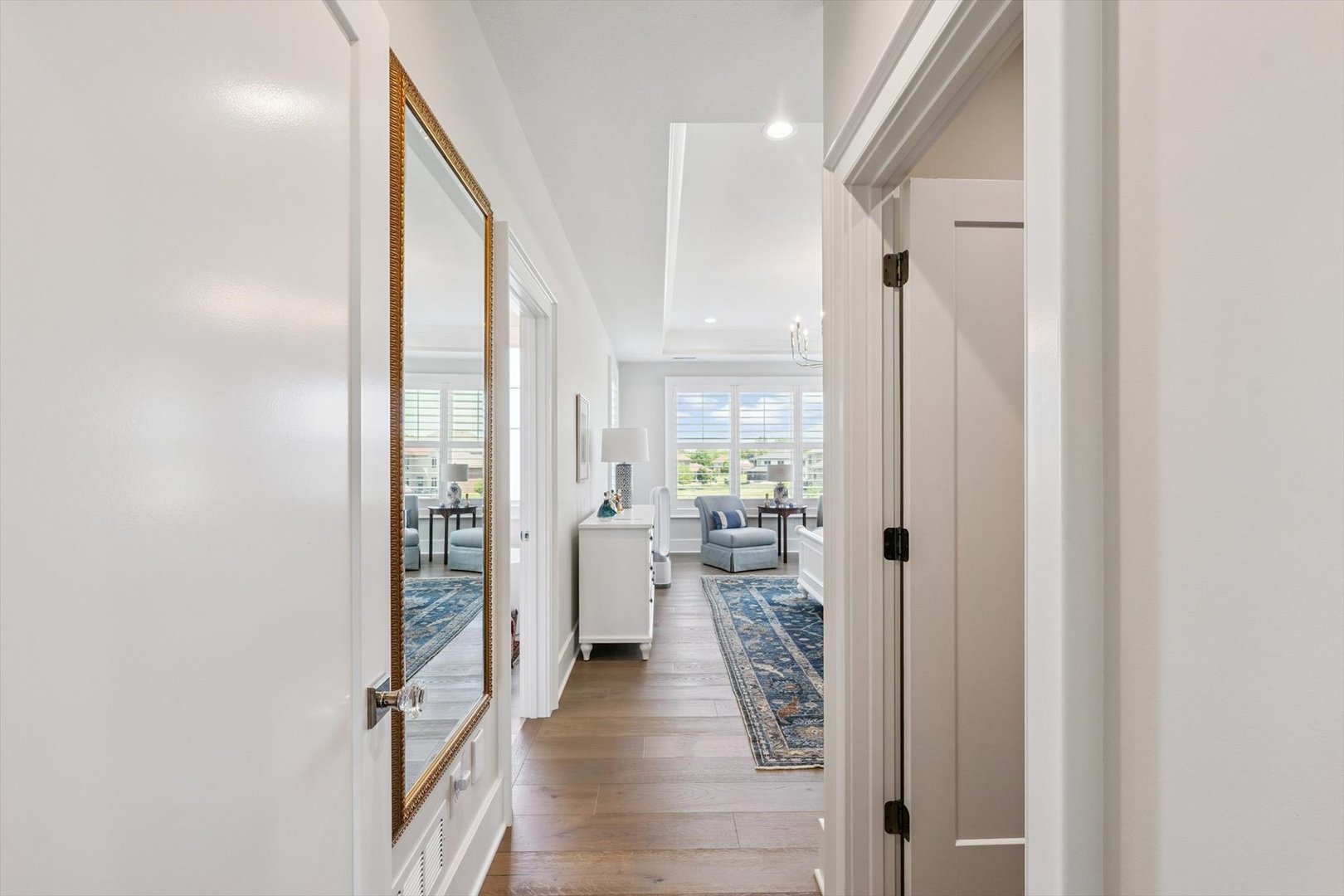 604 Cayman Way Savoy, IL 61874 - Photo 83 of 138 a view of a hallway with wooden floor windows and a livingroom