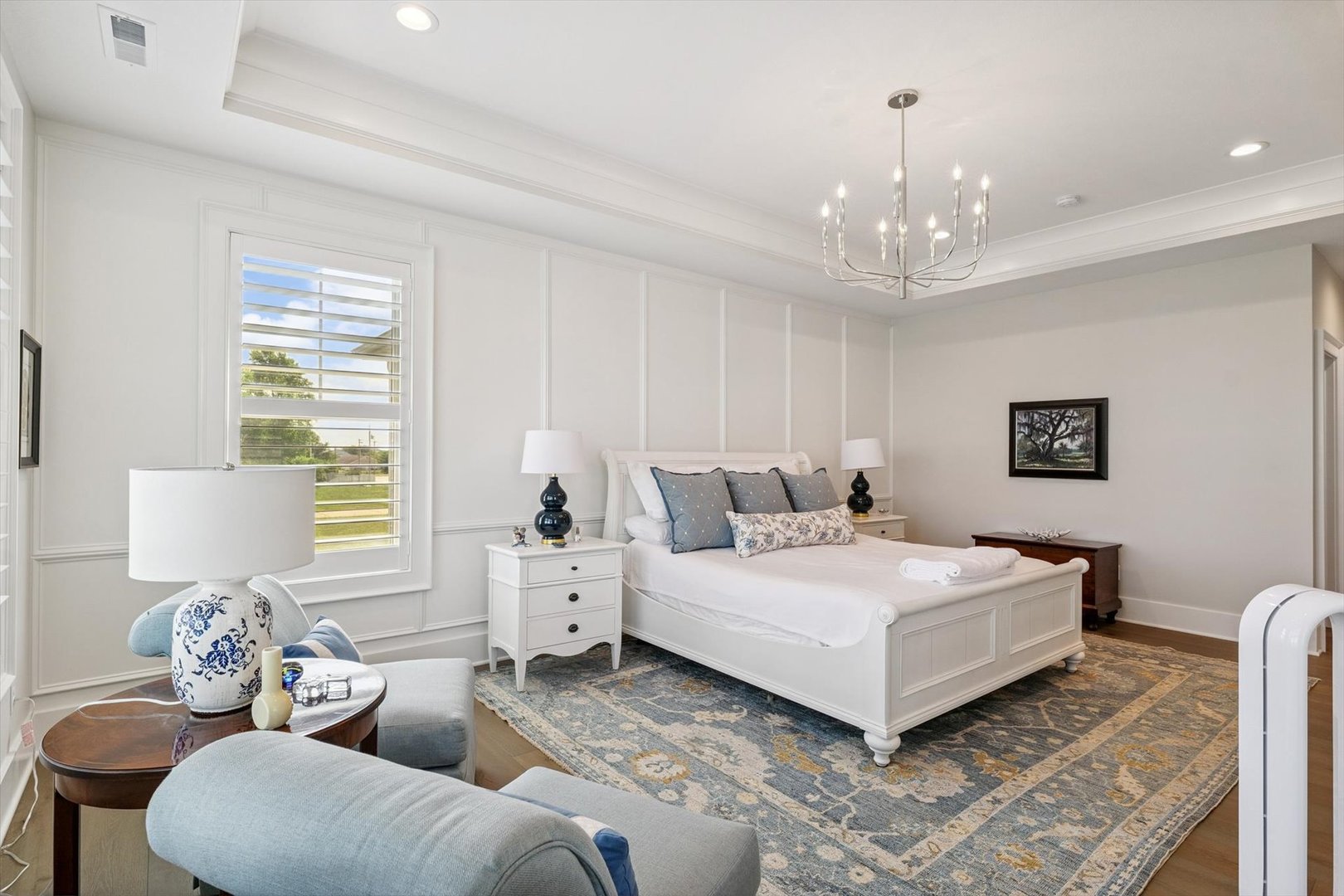 604 Cayman Way Savoy, IL 61874 - Photo 86 of 138 a spacious bedroom with a bed and a chandelier