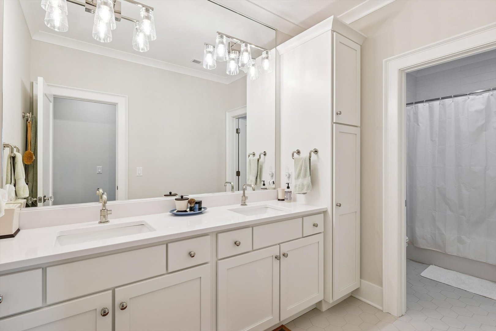 604 Cayman Way Savoy, IL 61874 - Photo 100 of 138 a bathroom with double vanity sinks a vanity a mirror and a shower