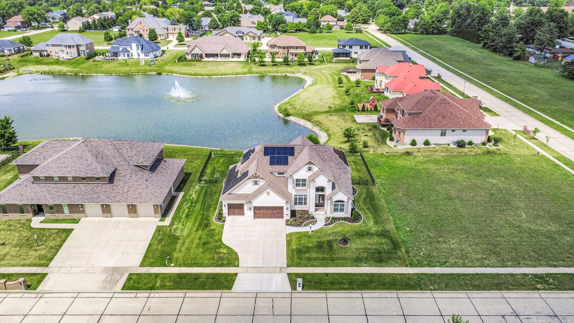 604 Cayman Way Savoy, IL 61874 - Photo 10 of 138 an aerial view of residential houses with outdoor space and lake view