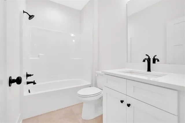 a bathroom with a sink a toilet and a bathtub