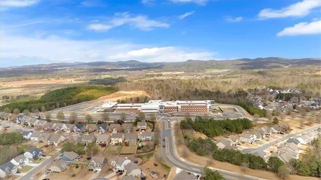 a view of a street with mountains in the background