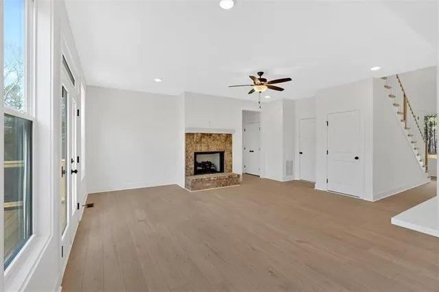 a view of an empty room with a fireplace