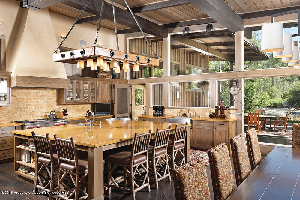 1055 Stage Road Aspen, CO 81611 - Photo 17 of 32 a view of a dining room with furniture window and outside view