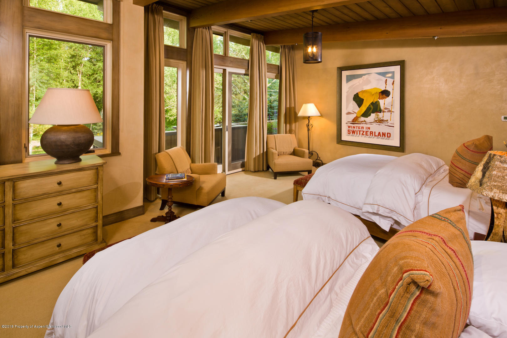 1055 Stage Road Aspen, CO 81611 - Photo 19 of 32 a bedroom with two beds and a painting on the wall