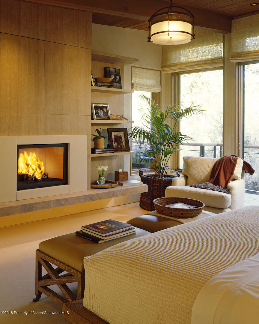 1055 Stage Road Aspen, CO 81611 - Photo 24 of 32 a living room with furniture and a flat screen tv