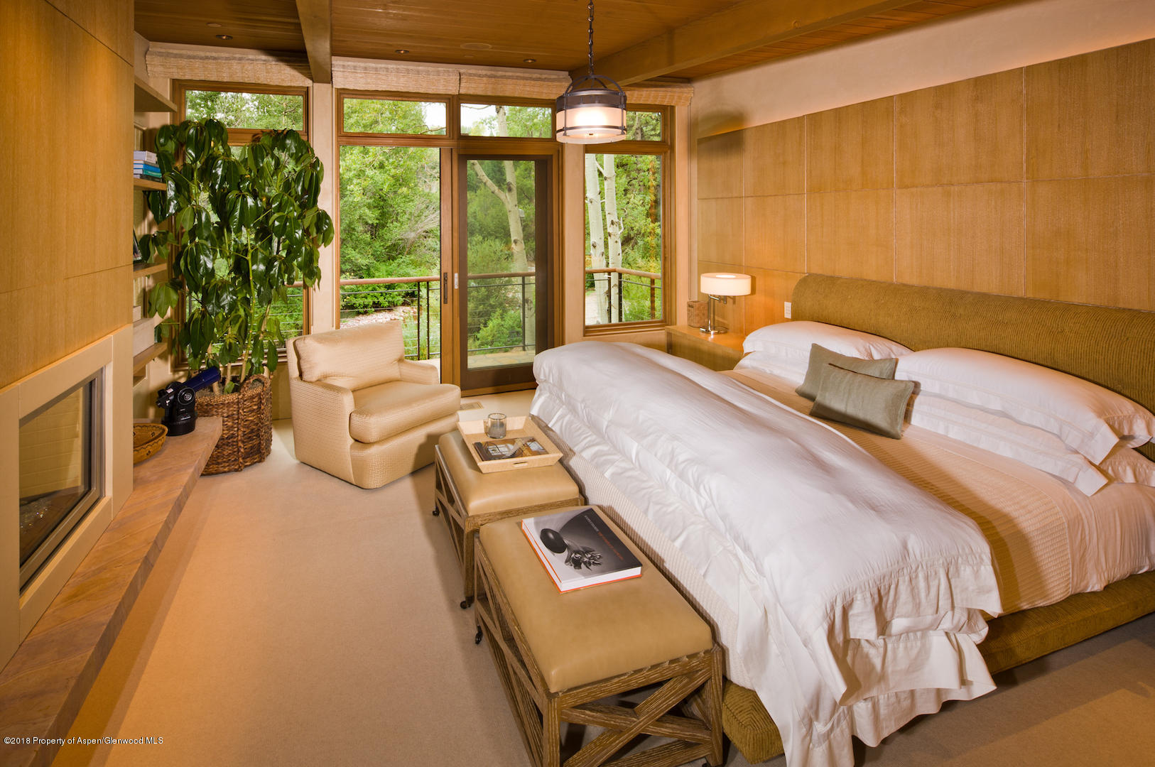 1055 Stage Road Aspen, CO 81611 - Photo 25 of 32 a bedroom with a bed and a window