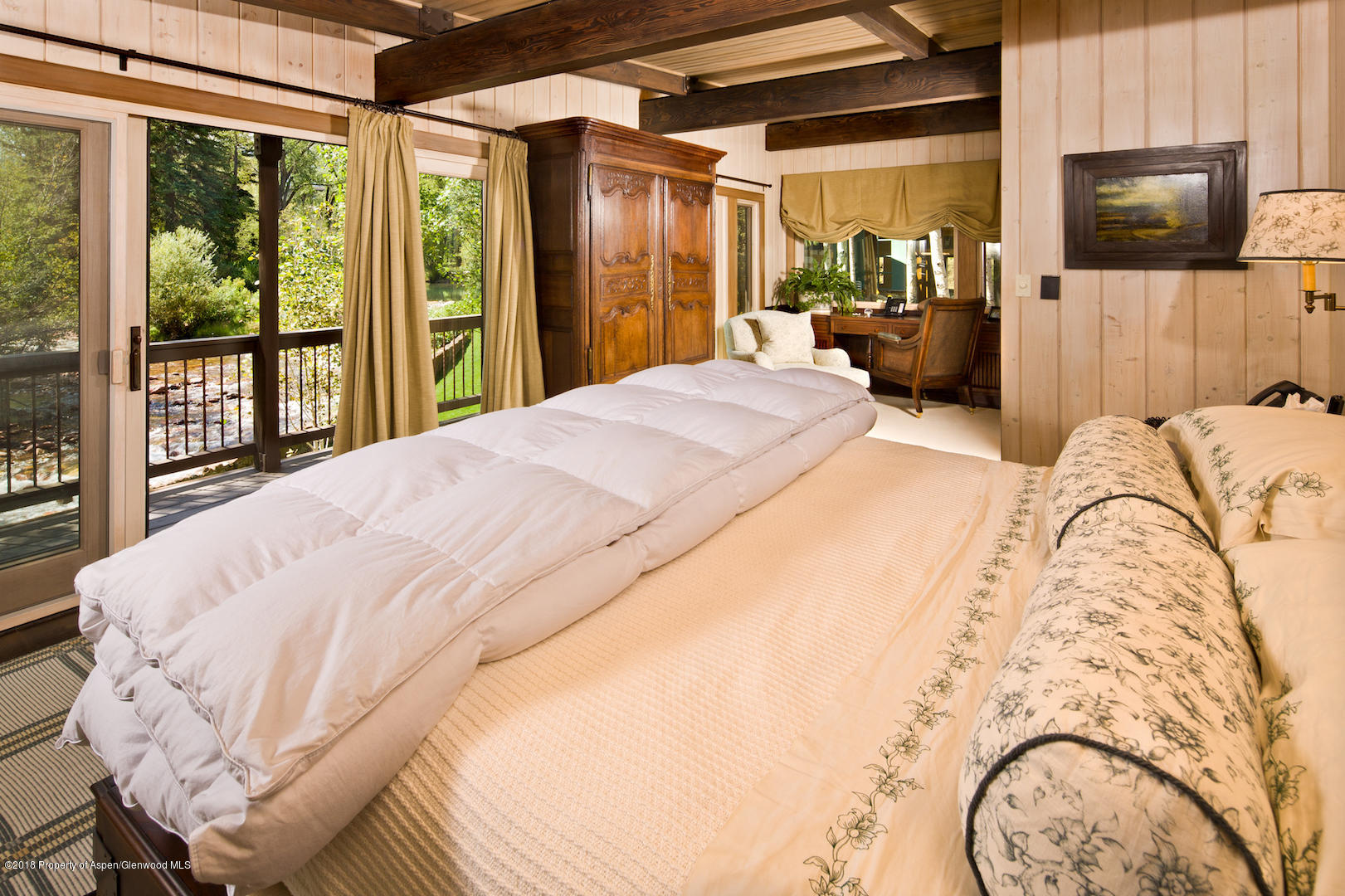 1055 Stage Road Aspen, CO 81611 - Photo 26 of 32 a bed sitting in a bedroom and a flat screen tv