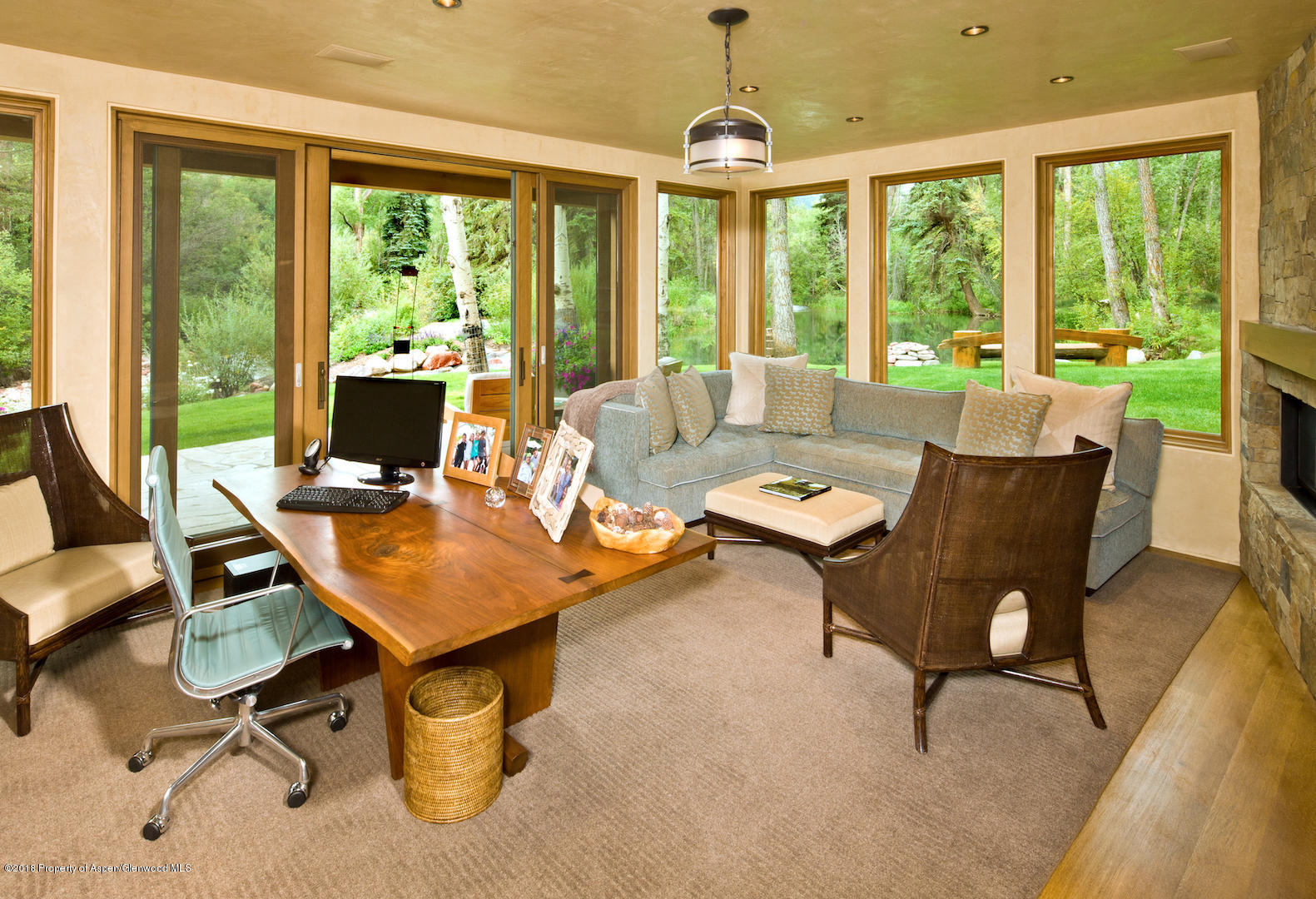 1055 Stage Road Aspen, CO 81611 - Photo 27 of 32 a living room with furniture and floor to ceiling windows