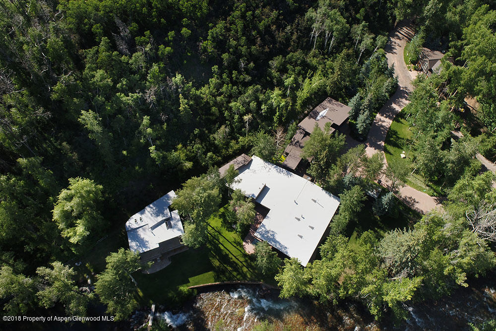 1055 Stage Road Aspen, CO 81611 - Photo 31 of 32 an aerial view of a house with a yard and outdoor seating