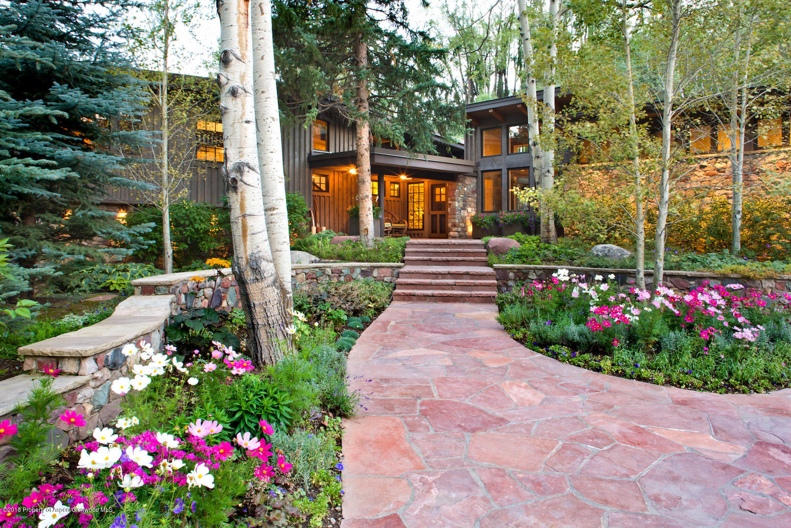 1055 Stage Road Aspen, CO 81611 - Photo 5 of 32 a view of flower garden with a building in the background