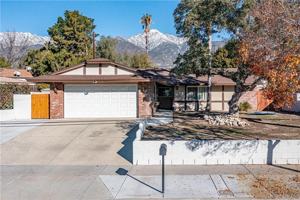 10324 Lemon Avenue Rancho Cucamonga, CA 91737 - Photo 1 of 1 a front view of a house with trees