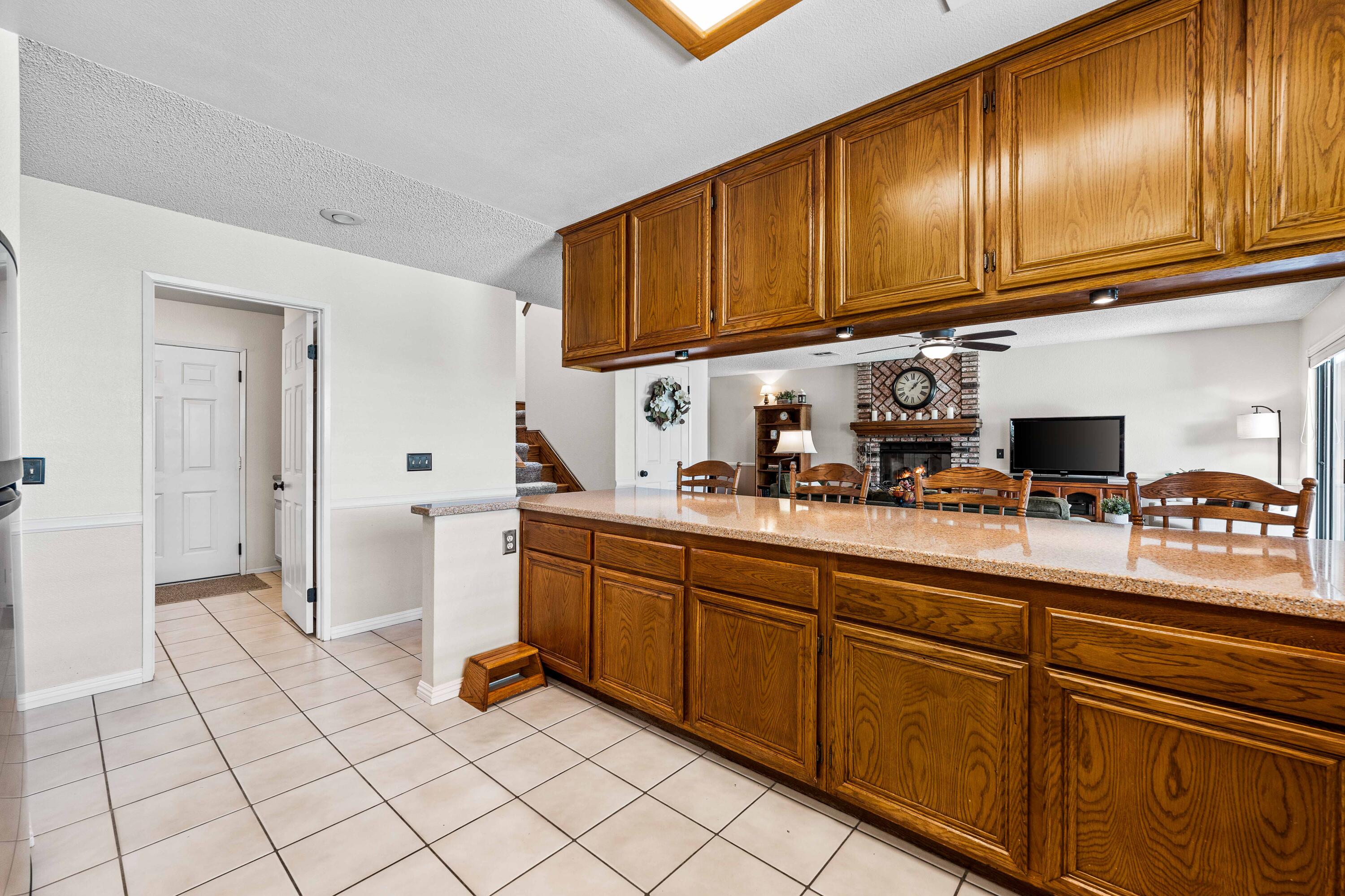 6311 West Ave L12 Lancaster, CA 93536 - Photo 15 of 55 a kitchen with stainless steel appliances granite countertop a sink and cabinets