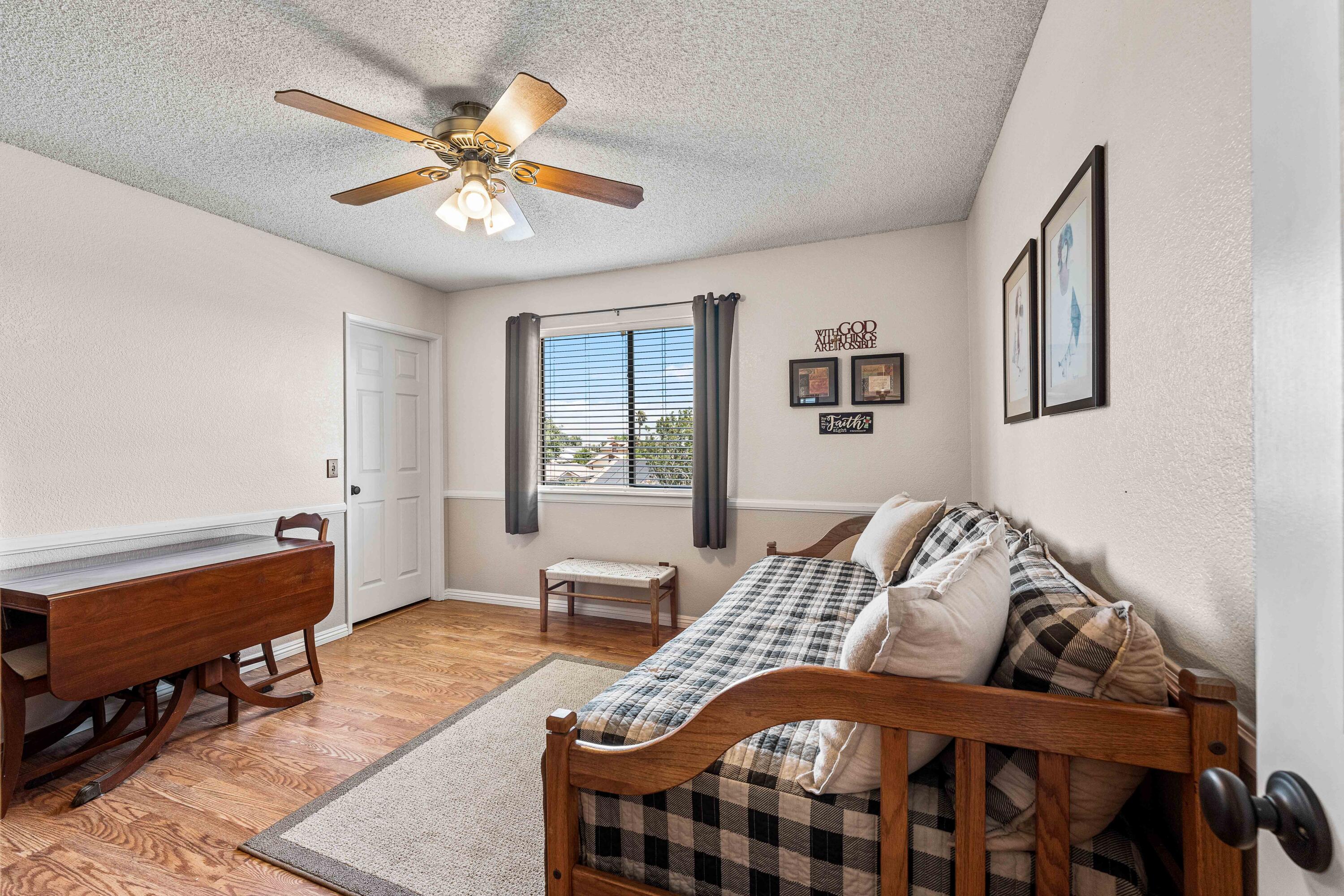 6311 West Ave L12 Lancaster, CA 93536 - Photo 24 of 55 a bedroom with furniture and a window