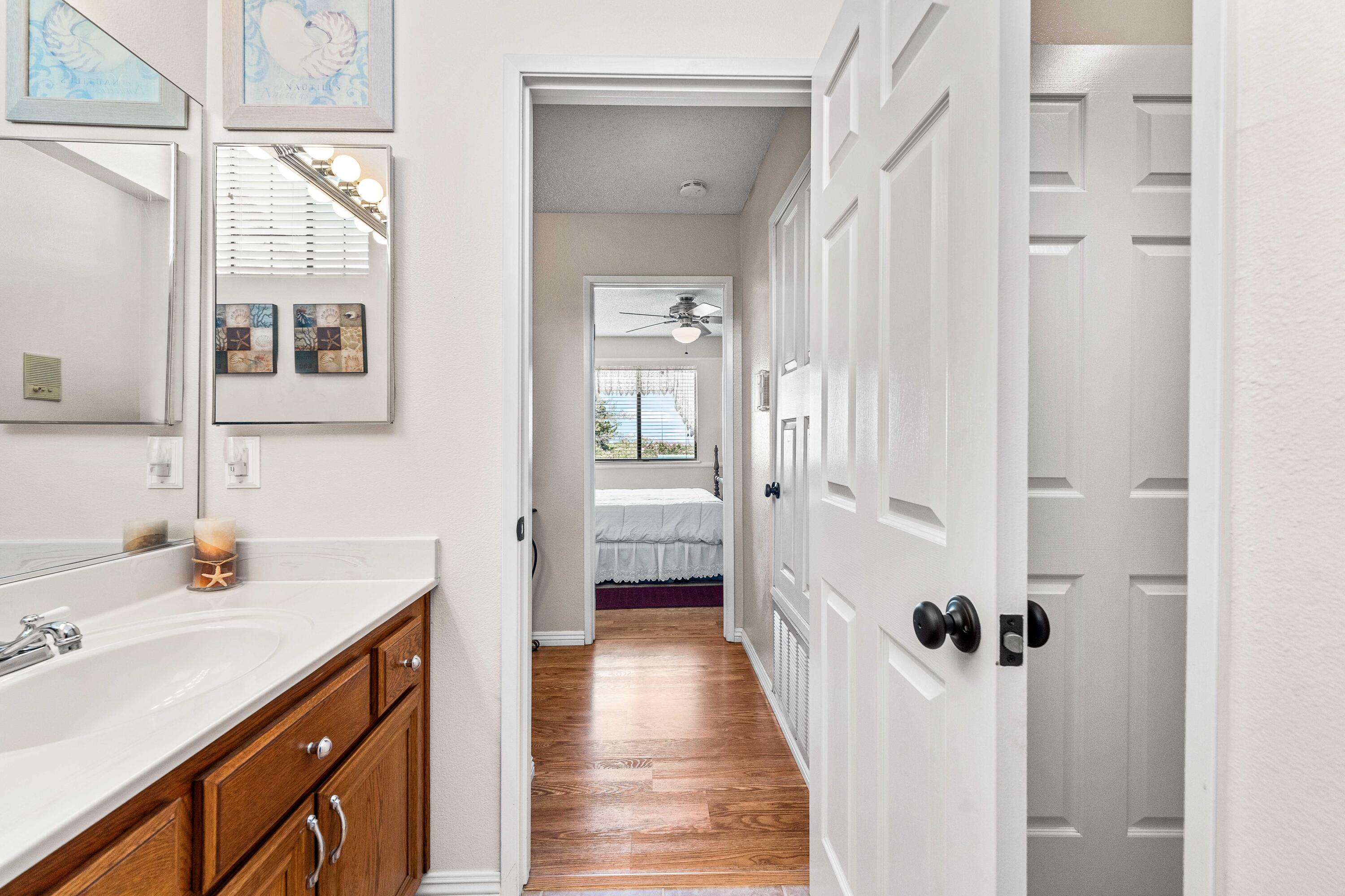 6311 West Ave L12 Lancaster, CA 93536 - Photo 29 of 55 a bathroom with a sink vanity and a mirror