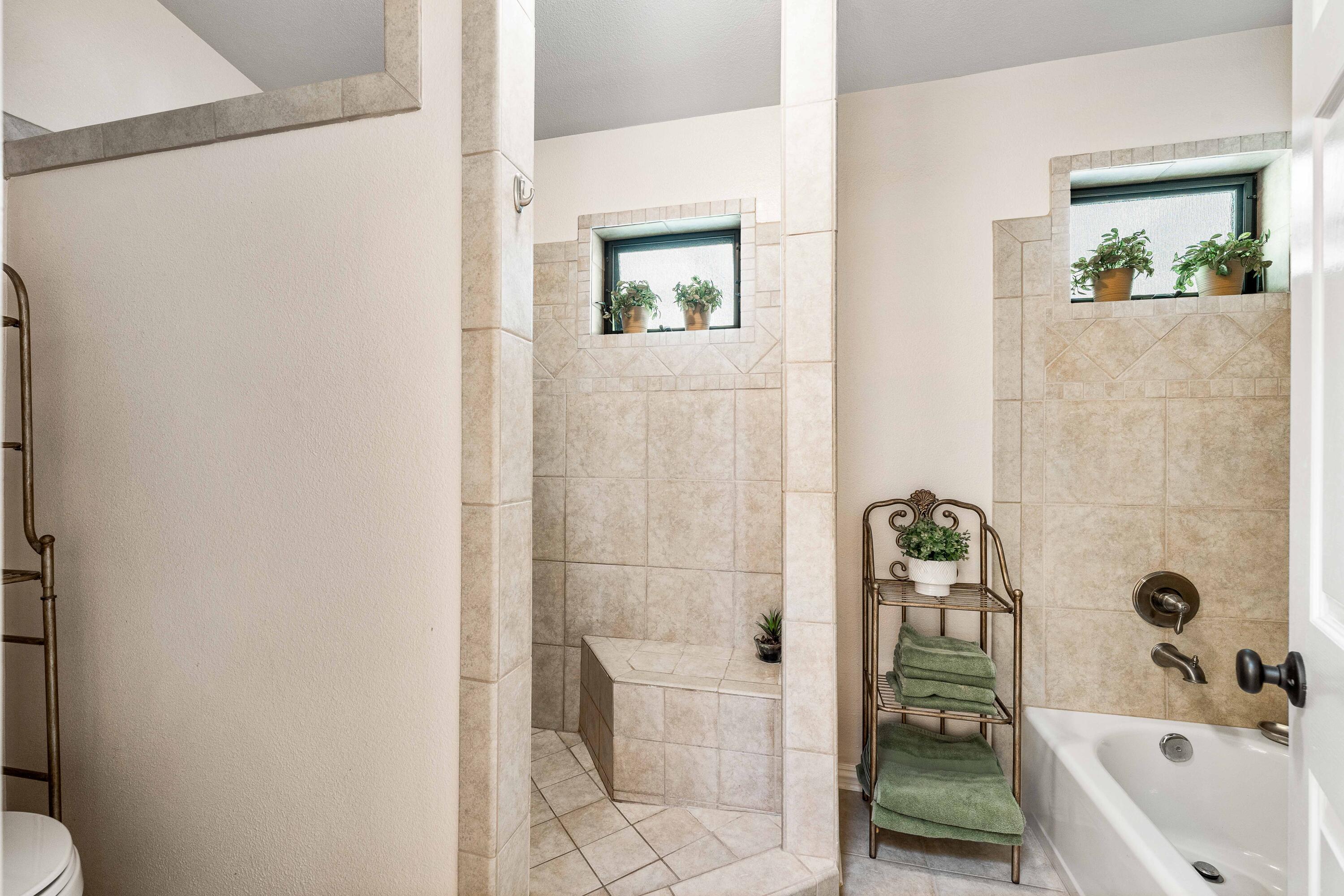 6311 West Ave L12 Lancaster, CA 93536 - Photo 40 of 55 a bathroom with a bathtub and shower