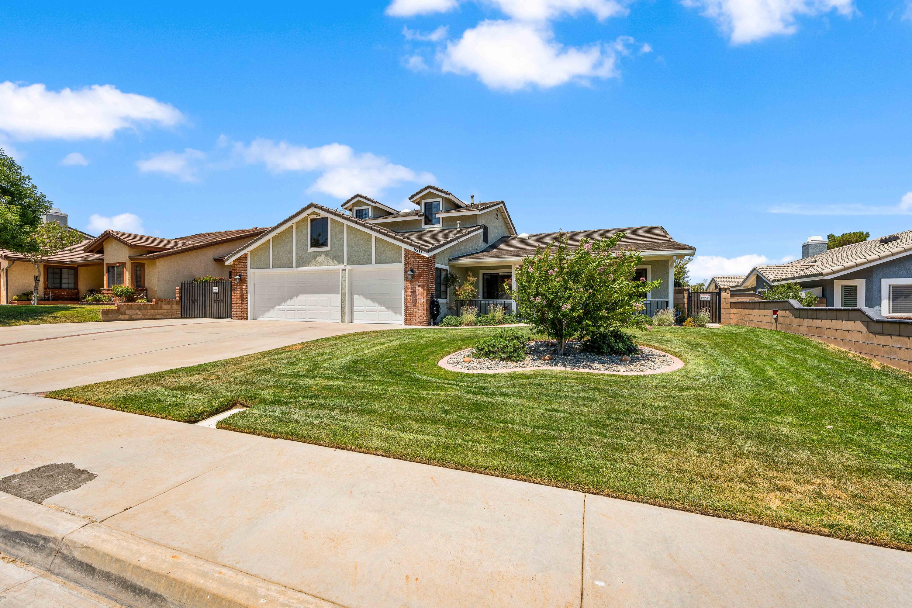 6311 West Ave L12 Lancaster, CA 93536 - Photo 4 of 55 a view of a house with a yard
