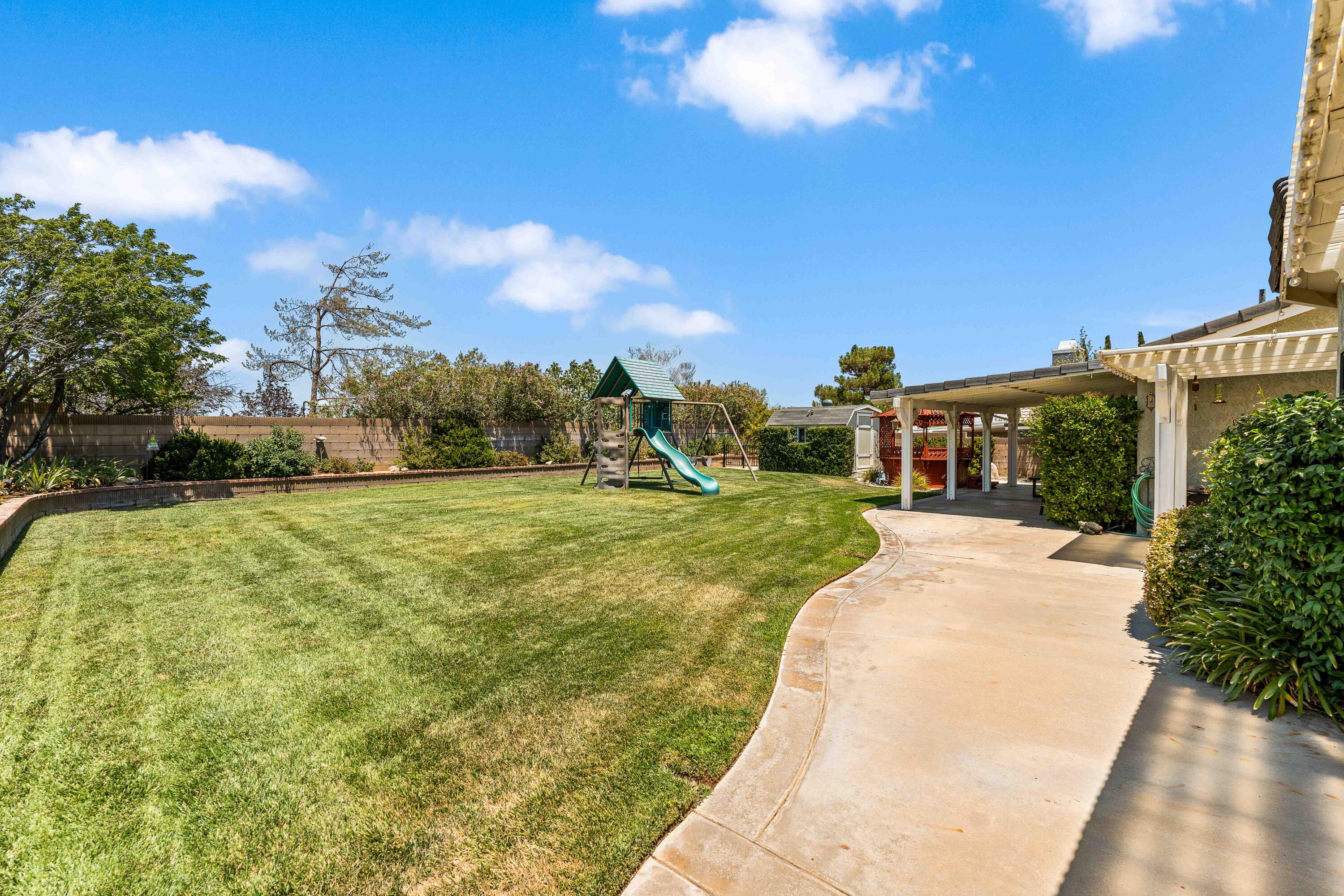 6311 West Ave L12 Lancaster, CA 93536 - Photo 45 of 55 a front view of a house with a yard