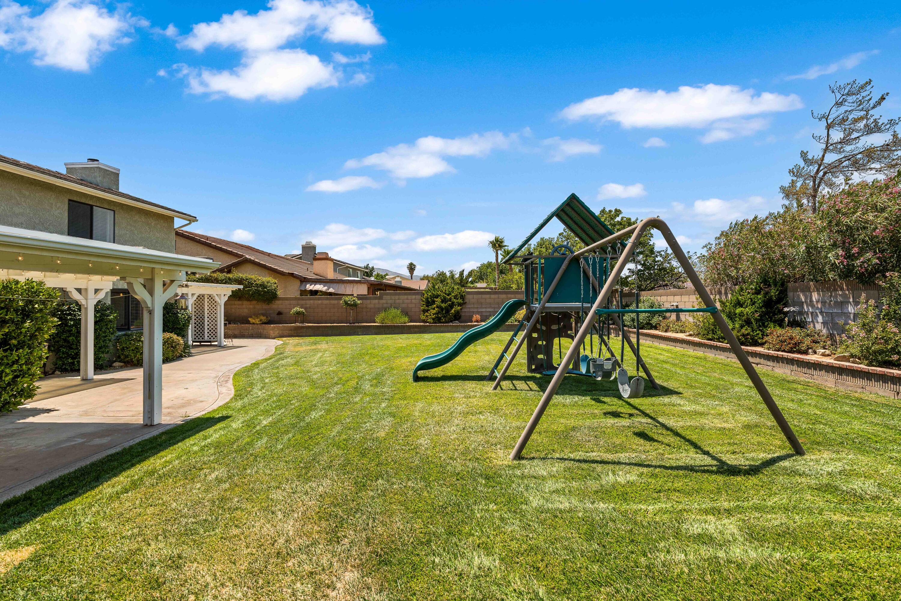 6311 West Ave L12 Lancaster, CA 93536 - Photo 49 of 55 a view of a house with swimming pool and sitting area