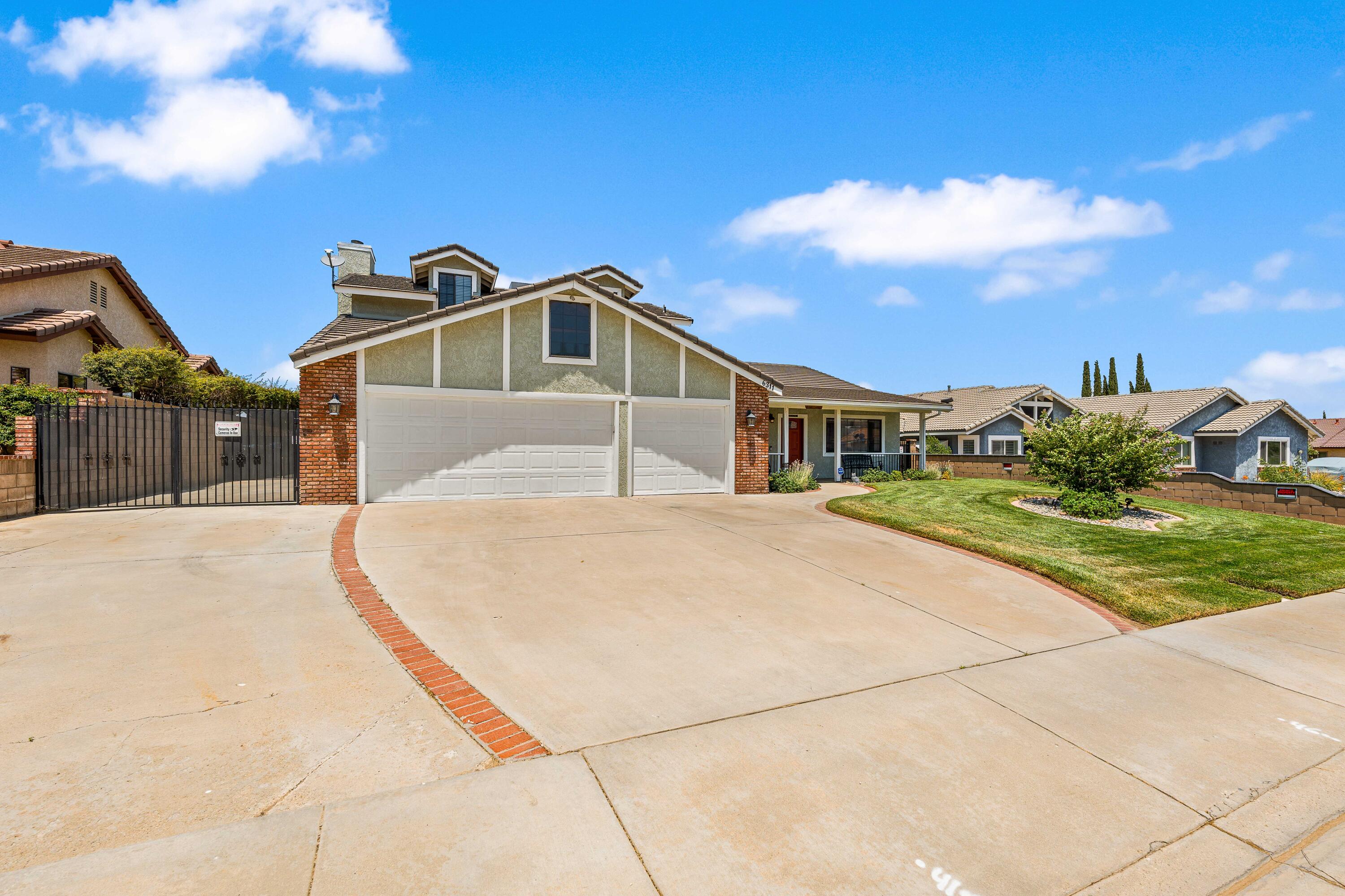 6311 West Ave L12 Lancaster, CA 93536 - Photo 5 of 55 a front view of a house with a yard
