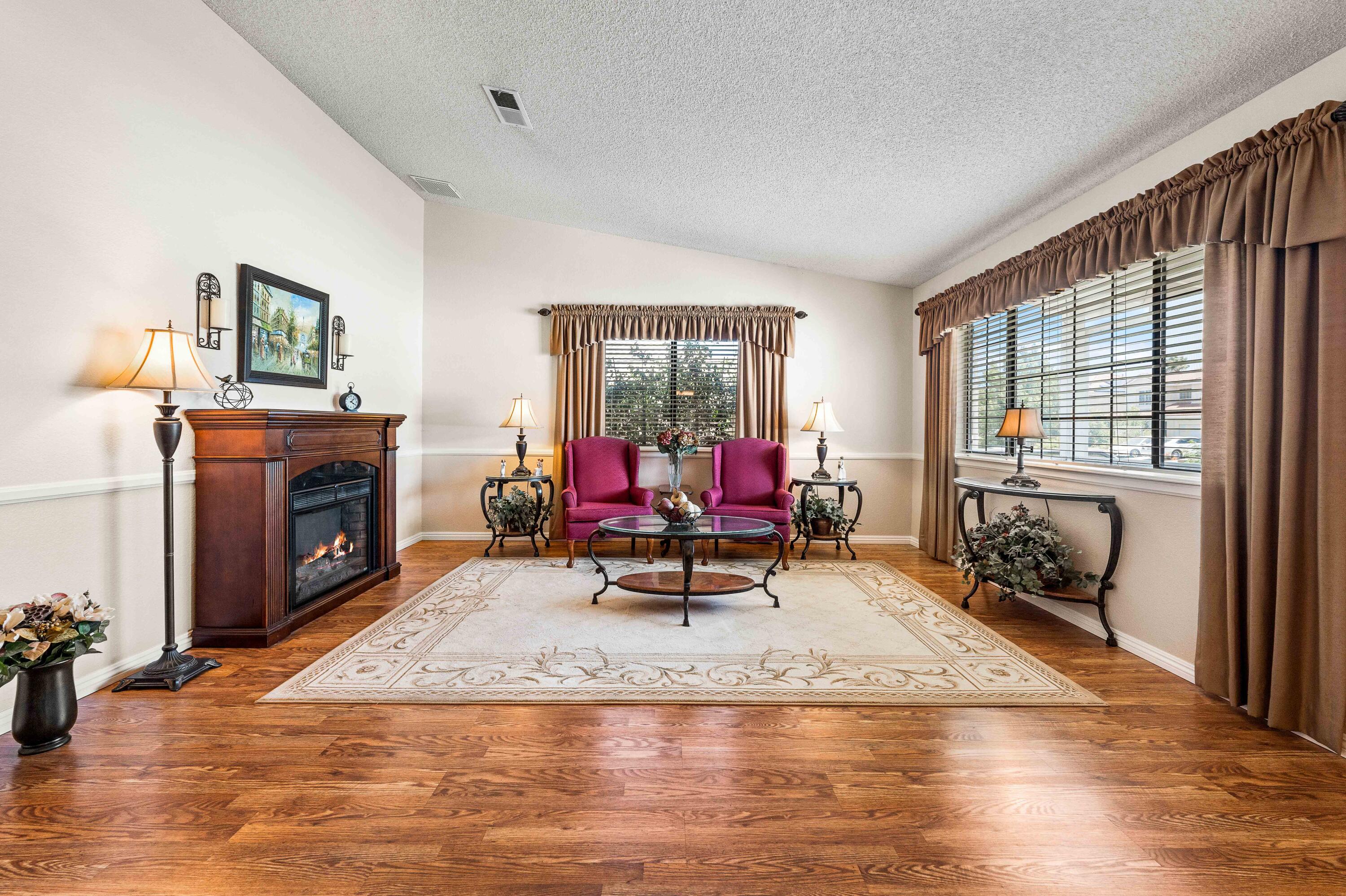 6311 West Ave L12 Lancaster, CA 93536 - Photo 7 of 55 a living room with furniture and a fireplace